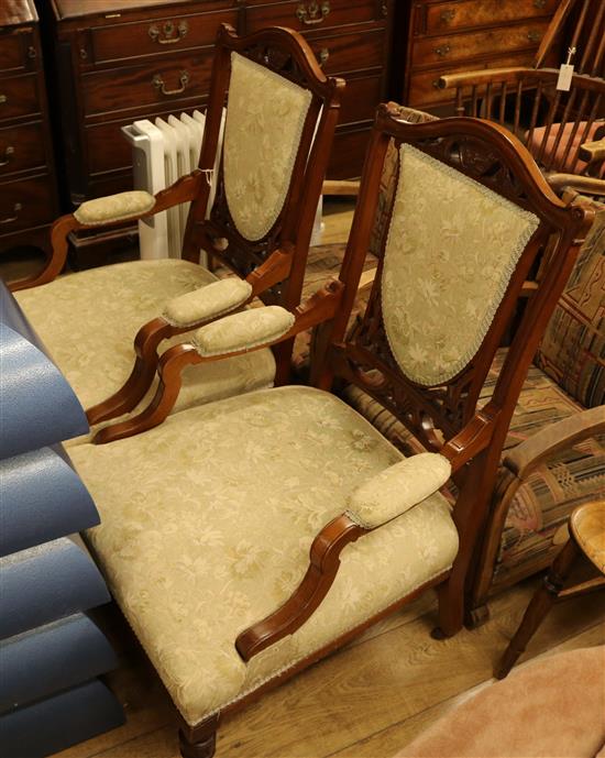 A pair of Victorian upholstered elbow chairs